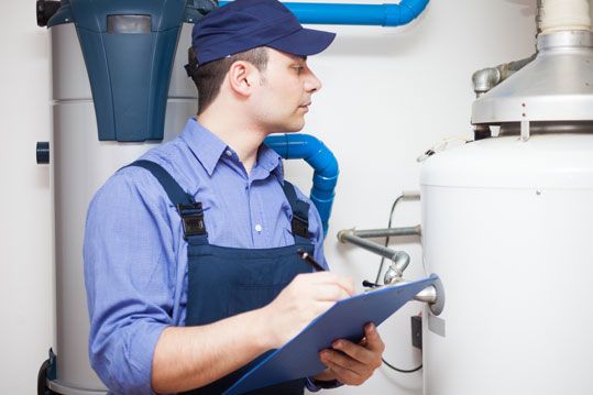 A Tsawwassen plumber performing a check on a water heater in Richmond